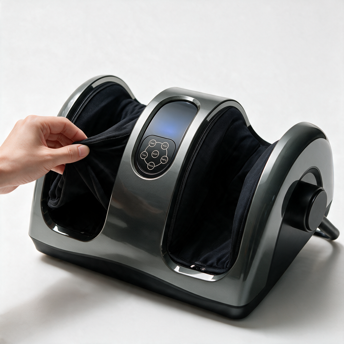 A hand lifting the removable, washable fabric liner of the Heated Shiatsu Foot & Calf Massager
