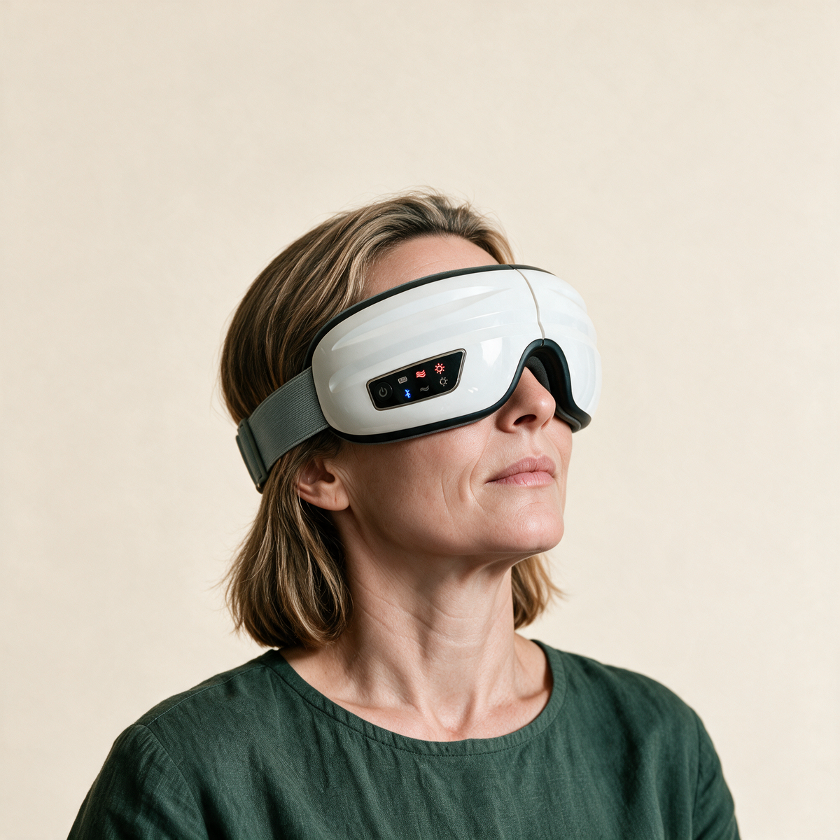 A woman wearing the Sena Body Heated Eye Massager