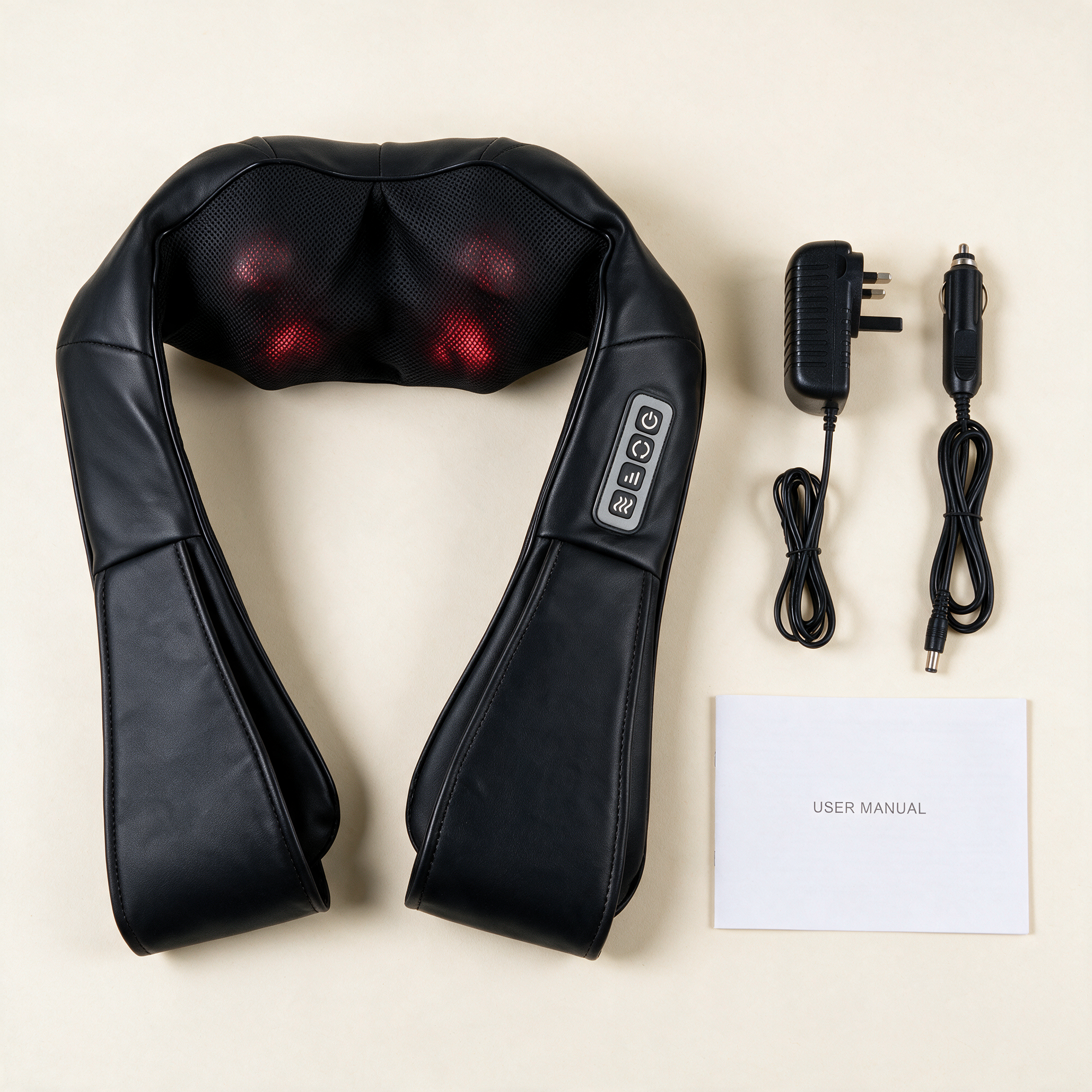 What is included with the Heated Shiatsu Neck & Shoulder Massager: the massager, a power adapter with a UK plug, an in-car power cable and a user manual